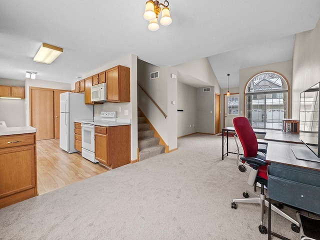 office area featuring light carpet and lofted ceiling