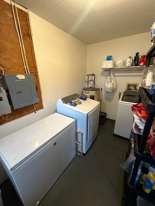 washroom featuring washer and clothes dryer, electric water heater, a textured ceiling, and electric panel