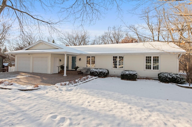 single story home featuring a garage