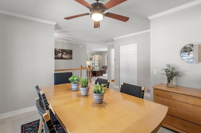 tiled dining space with a textured ceiling, ceiling fan, and crown molding