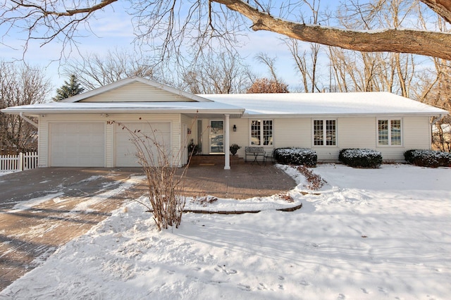 ranch-style house featuring a garage