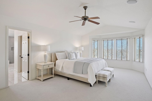 bedroom featuring ceiling fan, lofted ceiling, and carpet