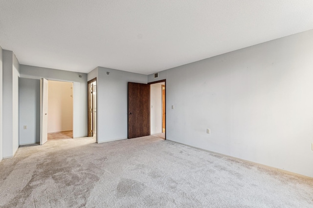 unfurnished bedroom with light carpet