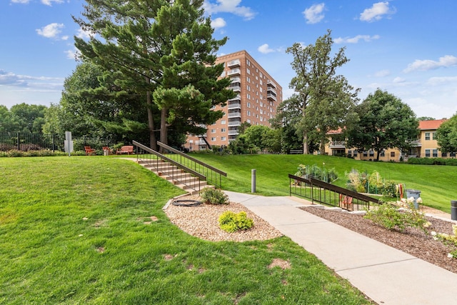 view of property's community with a lawn