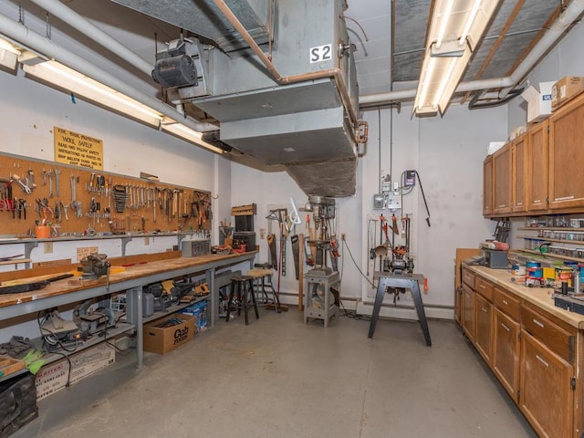 basement with a workshop area