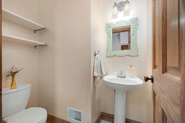 bathroom with sink and toilet