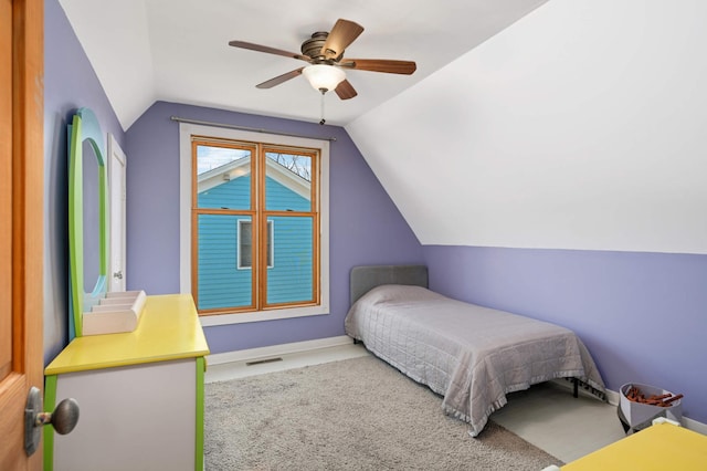 bedroom featuring light colored carpet, ceiling fan, and vaulted ceiling