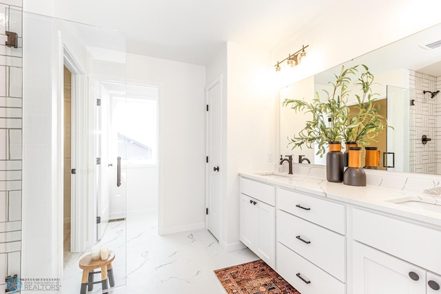 bathroom with vanity and an enclosed shower