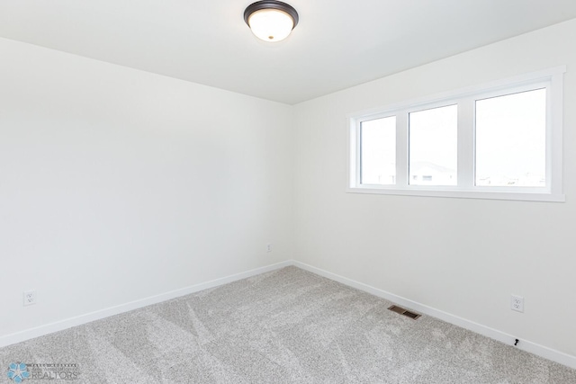 unfurnished room with carpet floors