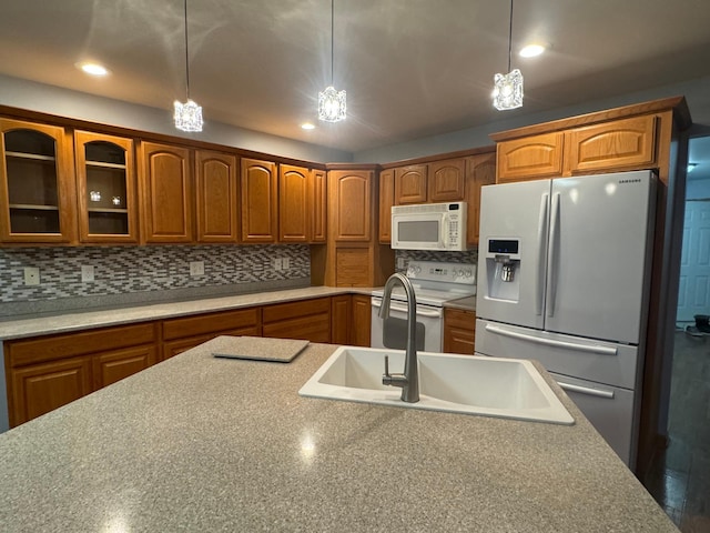 kitchen featuring tasteful backsplash, electric stove, hanging light fixtures, and stainless steel refrigerator with ice dispenser