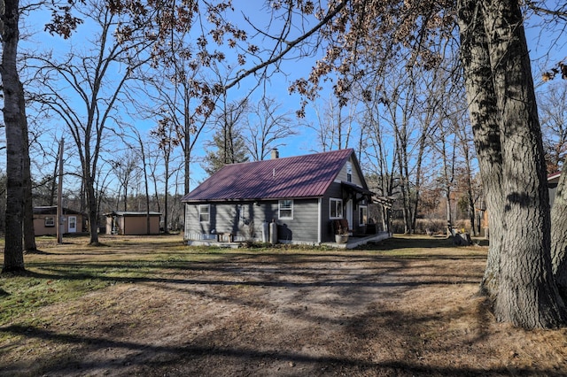 view of property exterior featuring a shed