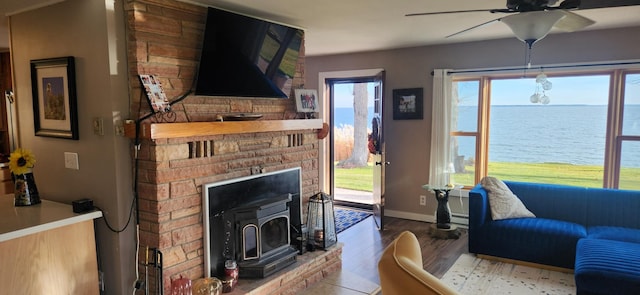 living room featuring ceiling fan and wood-type flooring