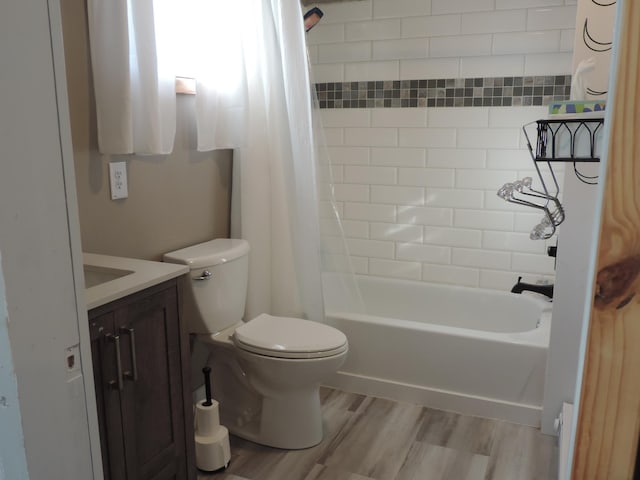 full bathroom featuring vanity, shower / bath combination with curtain, toilet, and wood-type flooring