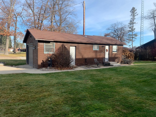 rear view of property with a yard