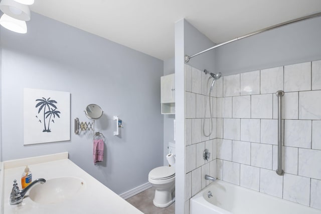 full bathroom with vanity, tile patterned flooring, tiled shower / bath, and toilet