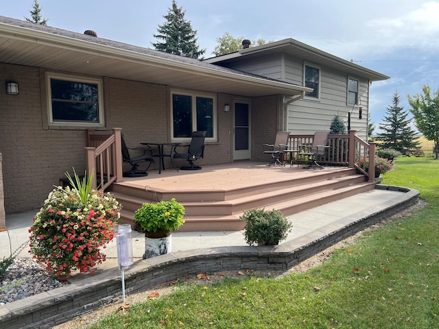 deck featuring a lawn