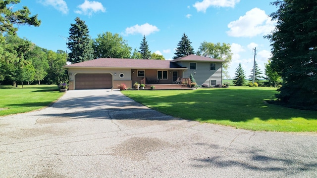 view of front of house featuring a garage, a wooden deck, and a front lawn