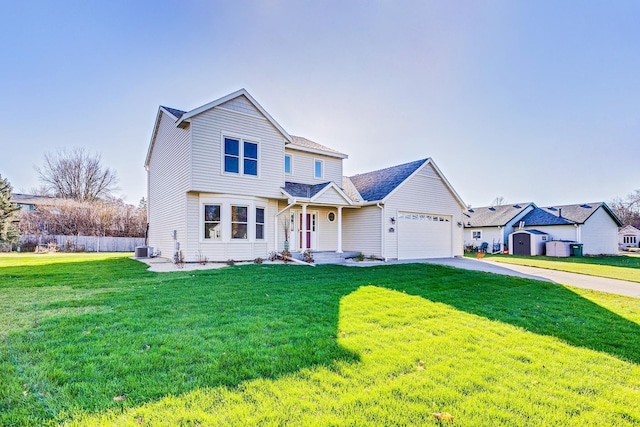 view of front of home with a front yard, central AC, and a garage