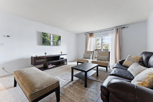 living room featuring light colored carpet and a textured ceiling