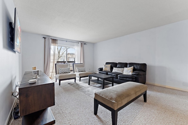 carpeted living room with a textured ceiling