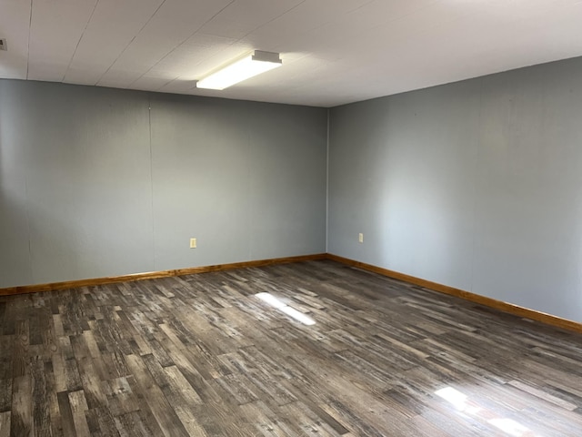 unfurnished room with wood-type flooring