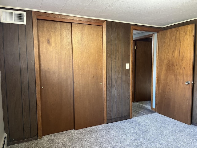 closet with a baseboard heating unit