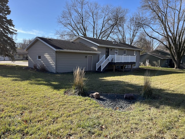 back of property featuring a lawn