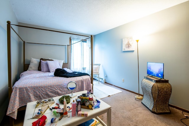 carpeted bedroom with a textured ceiling