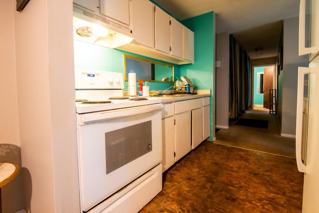 kitchen featuring white cabinetry, sink, and white electric range