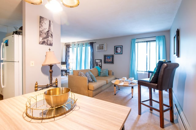 living room featuring light carpet, a baseboard radiator, and a wall mounted air conditioner