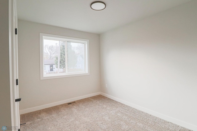 spare room featuring carpet floors