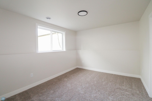 empty room with carpet and lofted ceiling