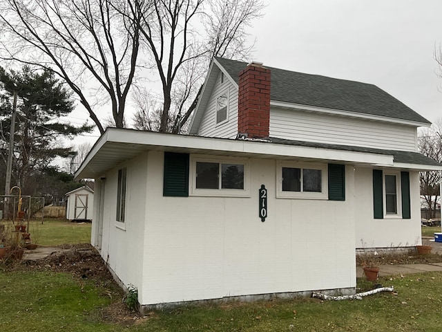 view of home's exterior featuring a storage shed