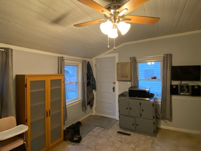 interior space featuring ceiling fan, wood ceiling, and lofted ceiling