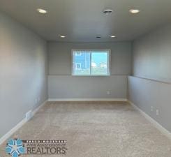 view of carpeted spare room