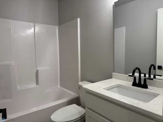 full bathroom with vanity, shower / bathtub combination, and toilet