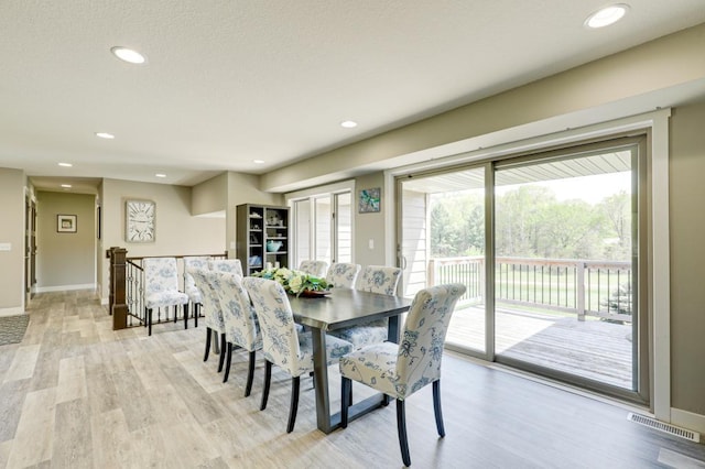 dining area featuring light wood-type flooring