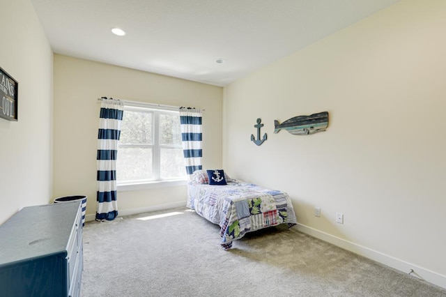 bedroom featuring light colored carpet