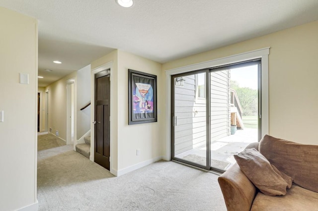 doorway to outside with light colored carpet