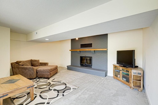 living room with light carpet and a fireplace