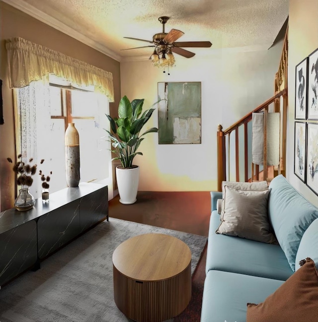 living room with a textured ceiling, ceiling fan, and ornamental molding