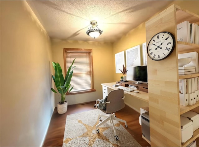 home office featuring a textured ceiling