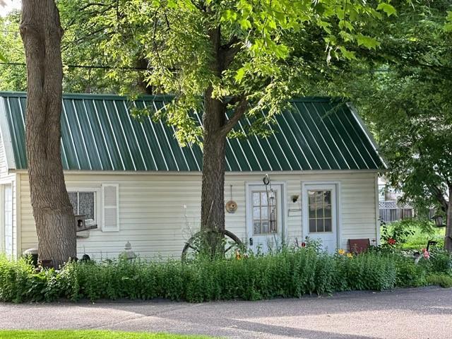 exterior space with metal roof