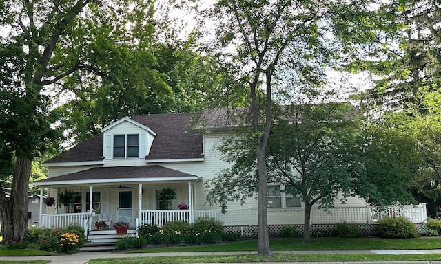 406 Rum River Dr, Princeton, MN 55371 - view of front of home with a porch, roof with shingles, and a front yard