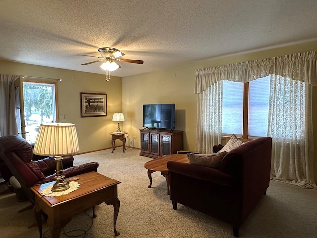 406 Rum River Dr, Princeton, MN 55371 - living area featuring ceiling fan, light colored carpet, a textured ceiling, and baseboards