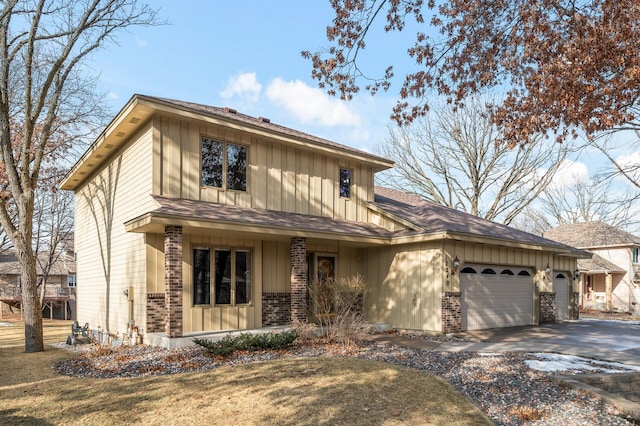 view of front of house featuring a garage and a front lawn