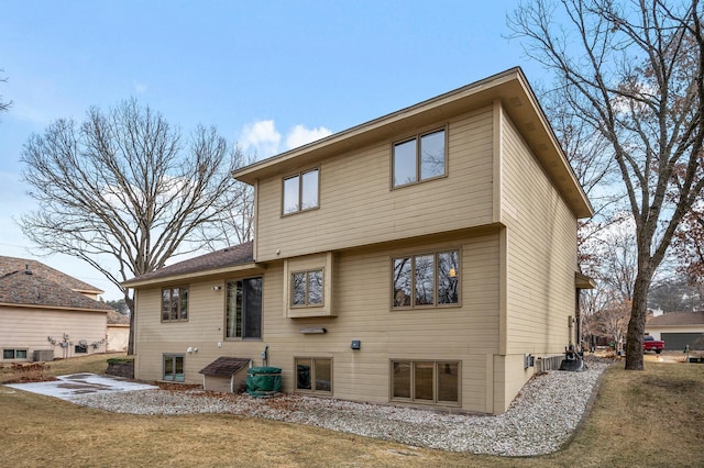 rear view of house with a yard and a patio area