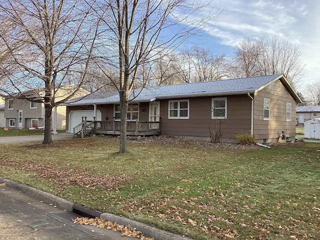 single story home with a front yard and a garage