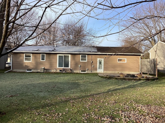 back of house with a lawn