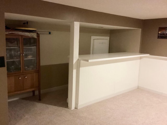 hallway with light colored carpet